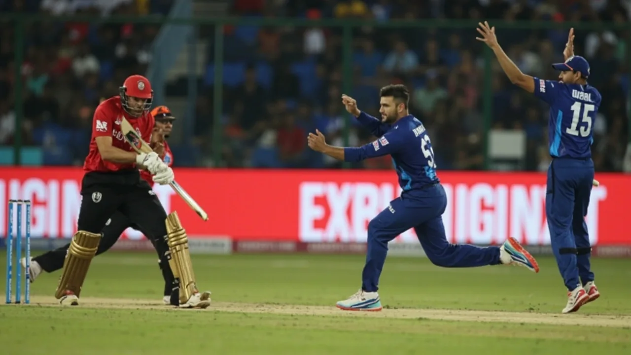 Medium tactical view of a cricket match under floodlights, with fielders spread across the outfield and the bowler preparing to deliver the ball